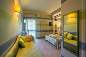 Cama ou camas em um quarto em Hotel Villamare