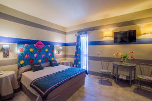 Ein Bett oder Betten in einem Zimmer der Unterkunft Hotel Villamare