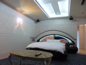 Postel nebo postele na pokoji v ubytování Hotel Sha La La