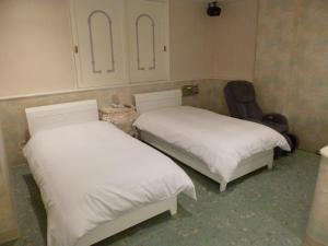 Postel nebo postele na pokoji v ubytování Hotel Sha La La