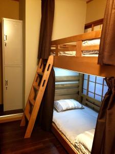 Ένα ή περισσότερα κρεβάτια σε δωμάτιο στο Suzuki Guesthouse