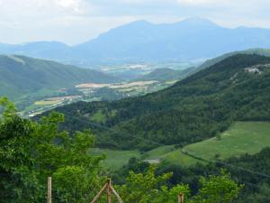 a view of a valley in the mountains at Belvilla by OYO Giammy in Acqualagna