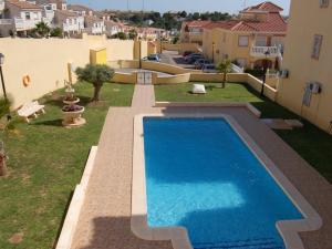 a swimming pool in the backyard of a house at Belvilla by OYO Casa da Costa in Villamartin