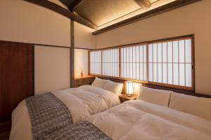 Gulta vai gultas numurā naktsmītnē Yoitsubaki Machiya House