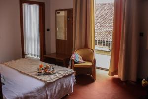 Postel nebo postele na pokoji v ubytování Hotel Lux