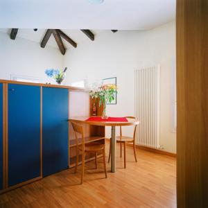 a dining room with a table and chairs at Residence Al Bacareto in Mogliano Veneto