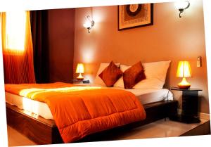 Säng eller sängar i ett rum på La Villa Serere