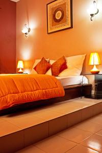 מיטה או מיטות בחדר ב-La Villa Serere