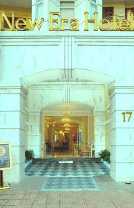 a lobby of a hotel with a sign on it at New Era Hotel & Villa in Hanoi