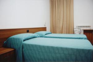 Postel nebo postele na pokoji v ubytování B&B La Collina