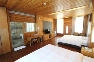 Postel nebo postele na pokoji v ubytování Pei Kong Creek Resort + 6 fotografií