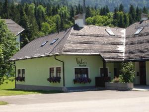 a building with a sign that reads warts centre at Wolfs Revier in Lackenhof