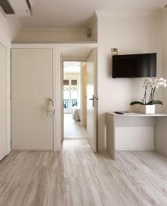 TV a/nebo společenská místnost v ubytování Hotel Plaza Esplanade