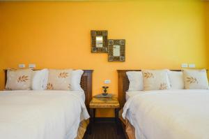 Un pat sau paturi într-o cameră la Ciao House B&B