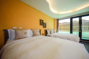 Un pat sau paturi într-o cameră la Ciao House B&B