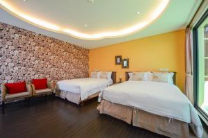 Un pat sau paturi într-o cameră la Ciao House B&B