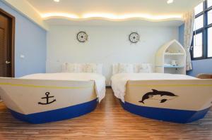 Un pat sau paturi într-o cameră la Ciao House B&B
