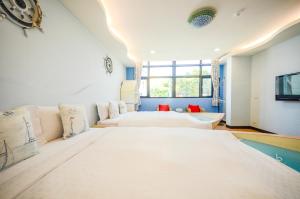 Un pat sau paturi într-o cameră la Ciao House B&B