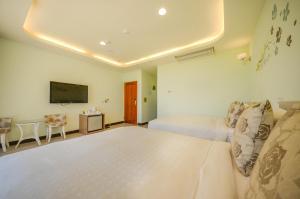 Un pat sau paturi într-o cameră la Ciao House B&B