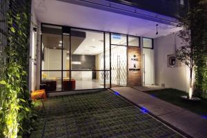 an external view of a house at night at Timez Hotel Melaka in Malacca