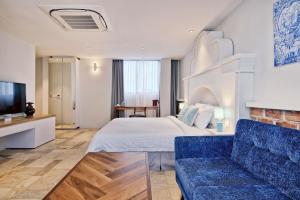 Postel nebo postele na pokoji v ubytování Timez Hotel Melaka