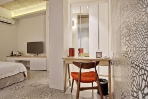 Postel nebo postele na pokoji v ubytování Timez Hotel Melaka