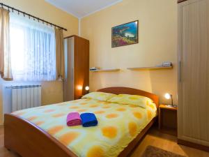 Postel nebo postele na pokoji v ubytování Apartments Davorka
