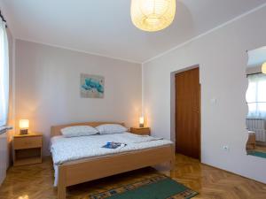 Postel nebo postele na pokoji v ubytování Apartments Davorka