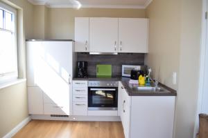 Kuchyň nebo kuchyňský kout v ubytování Villa Ocean Place