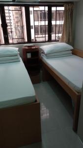 Cama o camas de una habitación en Pearl Guesthouse - 6/F
