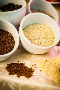 a group of bowls of seeds on a table at Hotel Centrale in Trieste