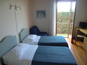 Postel nebo postele na pokoji v ubytování B&B Armonia