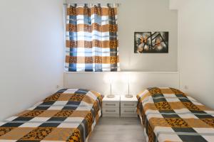 מיטה או מיטות בחדר ב-Apartments Mauri