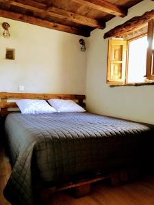 מיטה או מיטות בחדר ב-U Fragnu