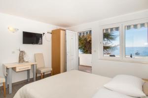 Apartments Zanic on The Beach客房内的一张或多张床位