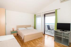 Apartments Zanic on The Beach客房内的一张或多张床位