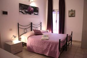 Tempat tidur dalam kamar di Affittacamere Villa Drusilla