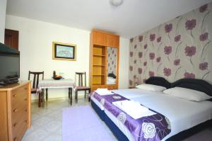 Łóżko lub łóżka w pokoju w obiekcie Apartments Balic