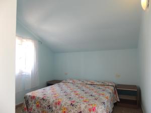Giường trong phòng chung tại Appartamenti Camping Rivamare