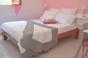Letto o letti in una camera di Thijo Guadeloupe