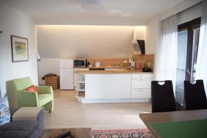 a kitchen with a couch and a counter in a room at Villa Mayr in Villach