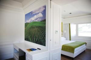 Postel nebo postele na pokoji v ubytování Grand Hotel Palace