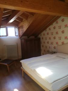 Postel nebo postele na pokoji v ubytování Cascina nel Bosco