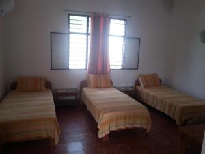 Postel nebo postele na pokoji v ubytování Hotel Orinoco Real