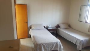 Postel nebo postele na pokoji v ubytování Hotel Orinoco Real