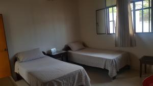 Postel nebo postele na pokoji v ubytování Hotel Orinoco Real