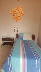 Postel nebo postele na pokoji v ubytování Hotel Orinoco Real