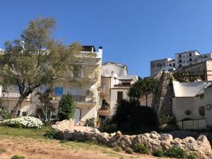 a group of white buildings in a city at Appartamento MareBello in Sperlonga
