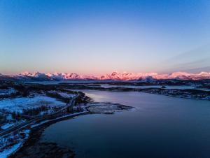 a view of a river with mountains in the background at Tysfjord Hotel in Storjord I Tysfjord