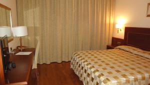 Posteľ alebo postele v izbe v ubytovaní Hotel Marconi